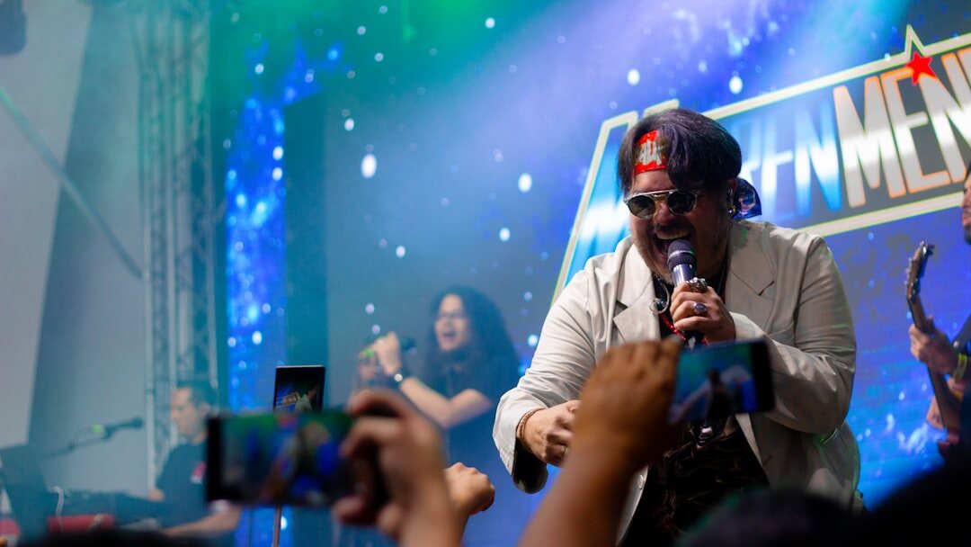 Cameraman filming a cultural event on stage